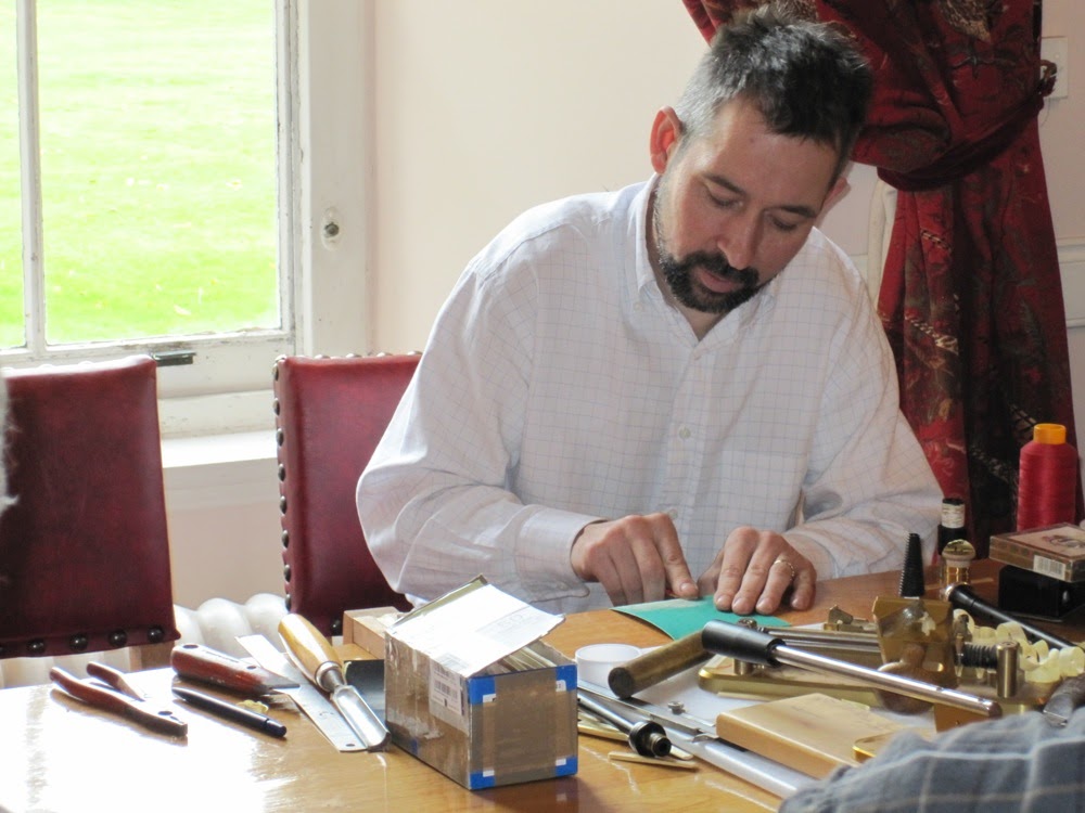 Ian demonstrating his reed making at a piping course